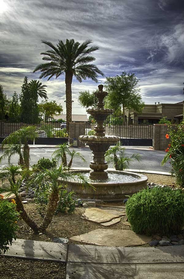 La Quinta community entrance fountain surrounded by palms and desert plantings
